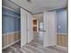 Bedroom with closet, blue walls, and wood-look floors, offering a peaceful retreat at 5015 Fox Cliff Dr, Lakeland, FL 33810