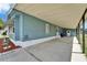 Spacious covered carport area, offering ample parking and access to the home's side entrance at 5015 Fox Cliff Dr, Lakeland, FL 33810