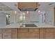 Close-up of the kitchen island with sleek countertops, pendant lighting, and ample cabinet space at 5015 Fox Cliff Dr, Lakeland, FL 33810