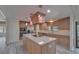 Modern kitchen featuring a central island, stainless steel appliances, and stylish pendant lighting at 5015 Fox Cliff Dr, Lakeland, FL 33810