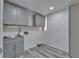 Laundry room with cabinetry, sink, and connections for a washer and dryer at 5015 Fox Cliff Dr, Lakeland, FL 33810