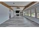 Open living space with fireplace, large windows, and modern ceiling fan at 5015 Fox Cliff Dr, Lakeland, FL 33810