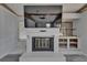Living room with a cozy fireplace and built-in shelving, perfect for relaxing at 5015 Fox Cliff Dr, Lakeland, FL 33810