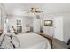 This spacious bedroom includes a television, ceiling fan, and a view of the bathroom at 5016 Forest Crest Dr, Lakeland, FL 33810