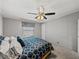 Cozy bedroom featuring a patterned bedspread and soft natural lighting at 5016 Forest Crest Dr, Lakeland, FL 33810