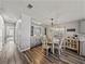 Inviting dining area boasts a round table, modern lighting, and stylish built-in cabinetry at 5016 Forest Crest Dr, Lakeland, FL 33810