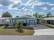 Charming single-story home with a covered carport and well-maintained landscaping at 5016 Forest Crest Dr, Lakeland, FL 33810