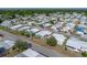 Charming mobile home featuring mature landscaping, accentuating a comfortable residential setting at 5016 Forest Crest Dr, Lakeland, FL 33810