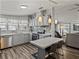 Modern kitchen featuring stainless steel appliances, mosaic backsplash, and an adjacent dining space at 5016 Forest Crest Dr, Lakeland, FL 33810
