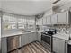 Updated kitchen featuring stainless steel appliances, stylish backsplash, and modern fixtures at 5016 Forest Crest Dr, Lakeland, FL 33810
