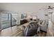 Open-concept living room with comfortable seating, large TV, and access to a screened lanai at 5016 Forest Crest Dr, Lakeland, FL 33810