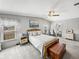 Comfortable main bedroom featuring ensuite bath, soft carpeting, and natural light at 5016 Forest Crest Dr, Lakeland, FL 33810