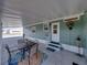 Covered patio features neutral decor and an outside dining area at 5016 Forest Crest Dr, Lakeland, FL 33810