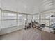 Bright sunroom with large windows, offering a versatile space for office or relaxation at 5016 Forest Crest Dr, Lakeland, FL 33810