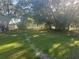Expansive backyard featuring mature trees offering ample shade and scenic views, ideal for outdoor activities at 5248 Rock Dove Trl, Lakeland, FL 33810