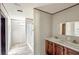 Bathroom featuring dual sinks, shower and ample counter space at 5248 Rock Dove Trl, Lakeland, FL 33810