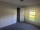Comfortable bedroom with a view, featuring carpet and ample natural light at 5248 Rock Dove Trl, Lakeland, FL 33810