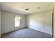 This carpeted bedroom has ample natural light at 5248 Rock Dove Trl, Lakeland, FL 33810