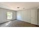Cozy bedroom features a neutral carpet and natural light at 5248 Rock Dove Trl, Lakeland, FL 33810