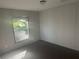 Cozy bedroom with carpet and a window providing natural light at 5248 Rock Dove Trl, Lakeland, FL 33810