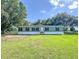 Charming single-story home featuring a well-maintained lawn and traditional architecture at 5248 Rock Dove Trl, Lakeland, FL 33810