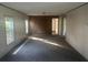 Spacious living room with windows, carpet flooring, and neutral wall colors at 5248 Rock Dove Trl, Lakeland, FL 33810