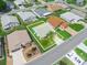 Aerial view of a property with a well-maintained lawn, highlighted property lines, and surrounded by neighboring homes at 537 Eagle Run, Lakeland, FL 33809