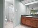Bathroom with shower, tile floor, updated vanity, and modern fixtures at 537 Eagle Run, Lakeland, FL 33809