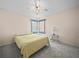 Bedroom featuring carpet, ceiling fan, and natural light from the window at 537 Eagle Run, Lakeland, FL 33809