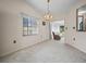 Open dining room showcasing neutral walls and plush carpet, perfect for entertaining or Gathering meals at 537 Eagle Run, Lakeland, FL 33809