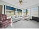 Bright Florida Room featuring lots of windows, neutral carpet, and comfortable furnishings at 537 Eagle Run, Lakeland, FL 33809