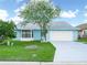 Charming one-story home featuring a spacious front yard and an attached two-car garage at 537 Eagle Run, Lakeland, FL 33809