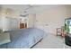 Primary bedroom featuring neutral paint, carpet and access to the en suite bathroom at 537 Eagle Run, Lakeland, FL 33809