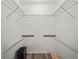 Spacious walk-in closet with wire shelving and wood flooring, offering ample storage at 537 Eagle Run, Lakeland, FL 33809