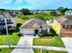 Aerial shot of a home in a suburban neighborhood with lush greenery at 5793 Dornich Dr, Auburndale, FL 33823
