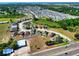 Aerial view showcases a desirable neighborhood with well-maintained homes and landscaping; conveniently located near amenities at 5793 Dornich Dr, Auburndale, FL 33823