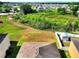 Backyard view with lush green foliage and serene neighborhood backdrop at 5793 Dornich Dr, Auburndale, FL 33823