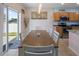 Open floor plan with dining table and sliding glass doors leading to the exterior at 5793 Dornich Dr, Auburndale, FL 33823