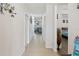 Bright hallway connecting living area, bedroom, and bathroom, all with neutral colors at 5793 Dornich Dr, Auburndale, FL 33823