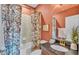 Bathroom featuring decorative shower curtain, garden tub and earth-toned walls at 6372 English Creek Dr, Lakeland, FL 33811
