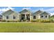 Charming single story home with a well-manicured lawn and landscaped flower beds at 6372 English Creek Dr, Lakeland, FL 33811