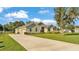 Charming single-story home featuring well-manicured lawn and a paved driveway at 6372 English Creek Dr, Lakeland, FL 33811