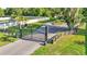 Gated property entrance with a long driveway and fenced perimeter at 6372 English Creek Dr, Lakeland, FL 33811