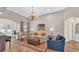 Comfortable living room featuring hardwood floors, natural light, and neutral decor at 6372 English Creek Dr, Lakeland, FL 33811