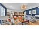Spacious living room with kitchen view, stylish furnishings, and bright lighting at 6372 English Creek Dr, Lakeland, FL 33811