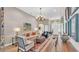 Bright and airy living room with hardwood floors, large windows, and stylish furnishings at 6372 English Creek Dr, Lakeland, FL 33811