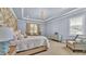 Serene main bedroom with trey ceilings, floral wallpaper and a chandelier at 6372 English Creek Dr, Lakeland, FL 33811