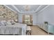 Bright main bedroom with a sitting area, chandelier, and neutral tones at 6372 English Creek Dr, Lakeland, FL 33811