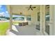 Covered patio with ceiling fans and outdoor furniture with neighborhood view at 6372 English Creek Dr, Lakeland, FL 33811