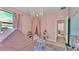 Adorable pink playroom features a tent, table set, and lots of toys for  at 6372 English Creek Dr, Lakeland, FL 33811